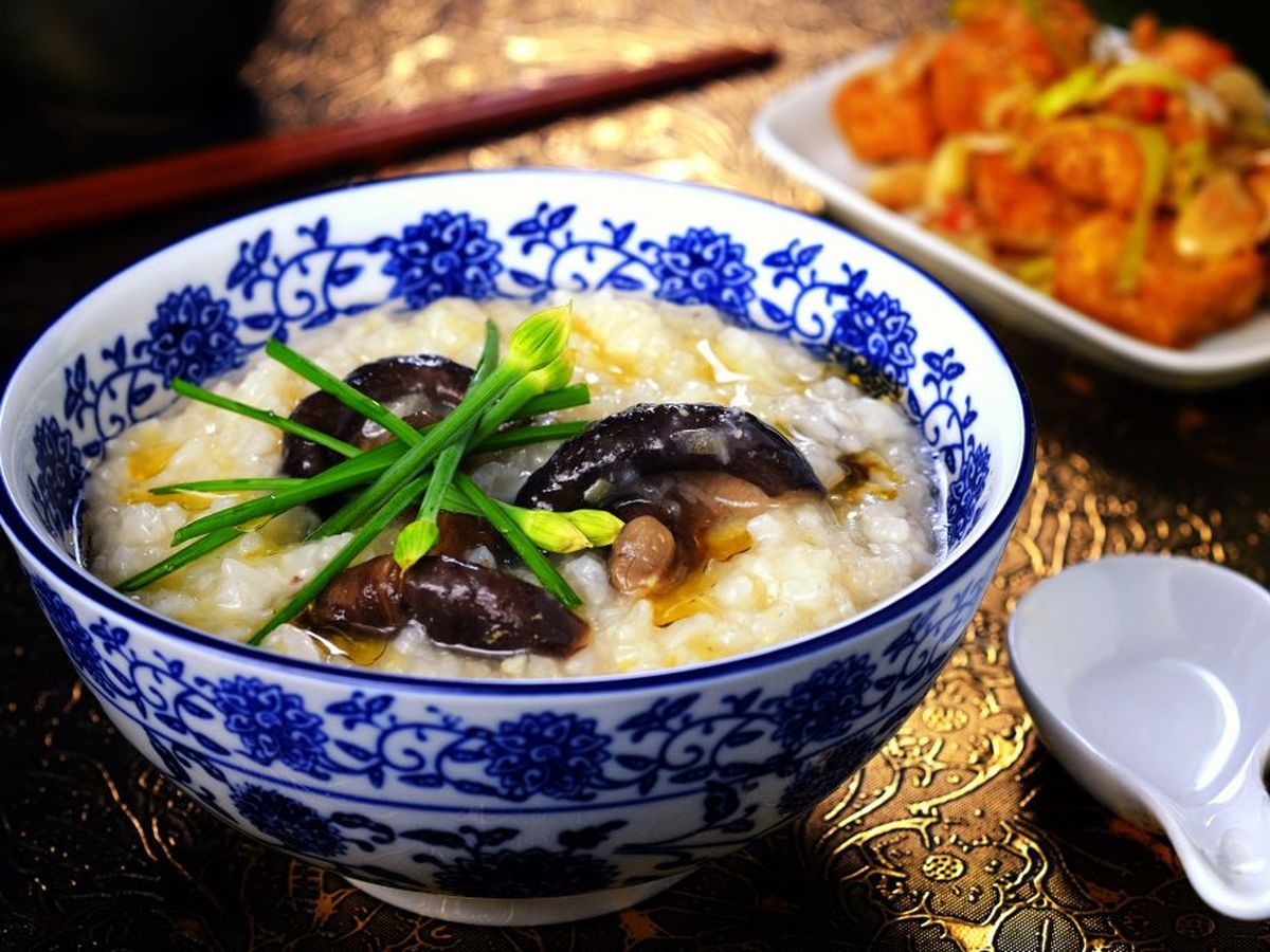 Image of a bowl of Congee with mushrooms.