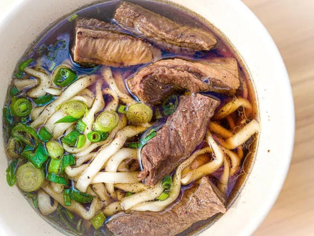 Image of a bowl of Beef Noodle Soup.