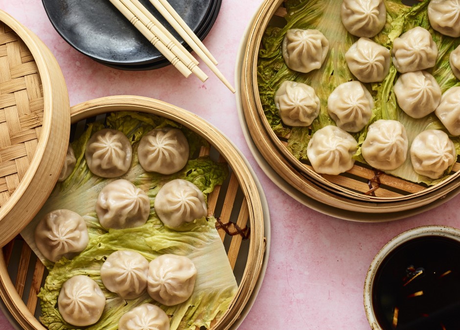 Image of soup dumplings in a bamboo steamer.