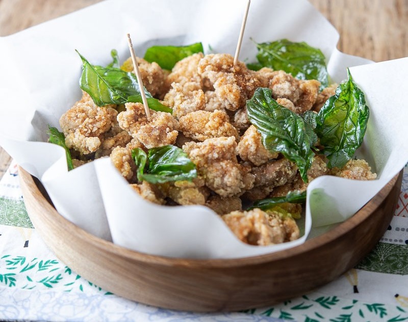 Image of popcorn fried chicken in a shallow dish.