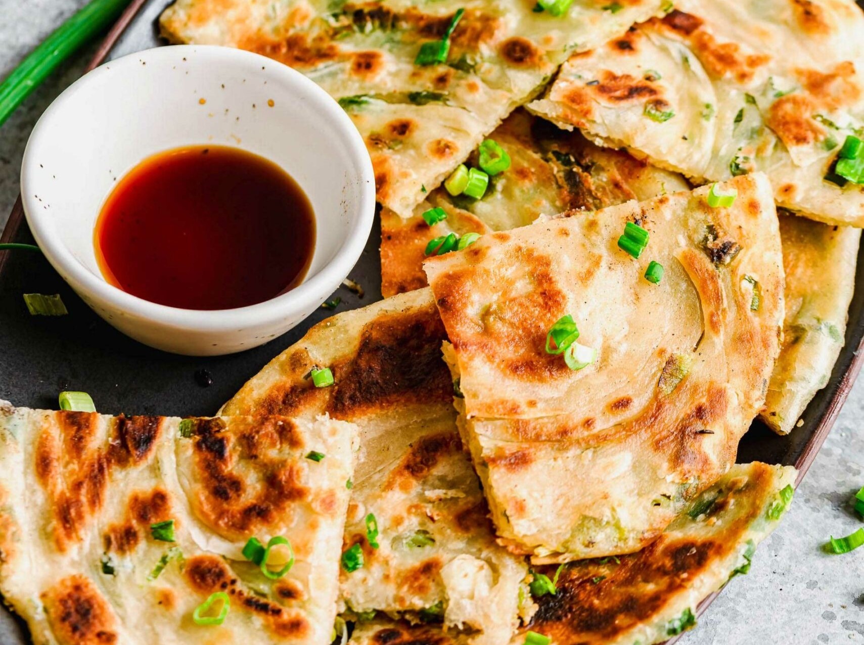 Image of a platter of Flakey Scallion Pancakes.