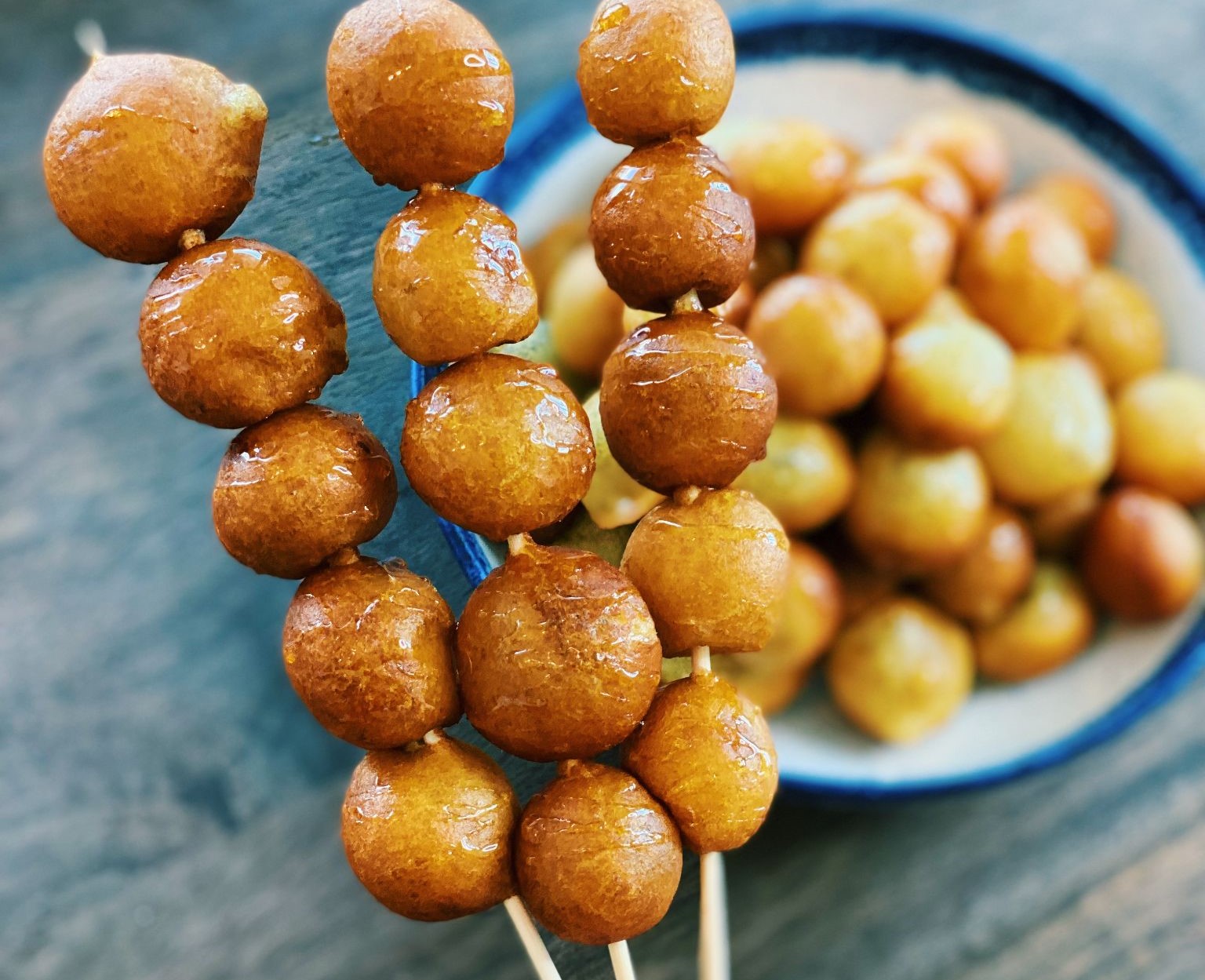 Image of Puffed Sweet Potato Balls on skewers.